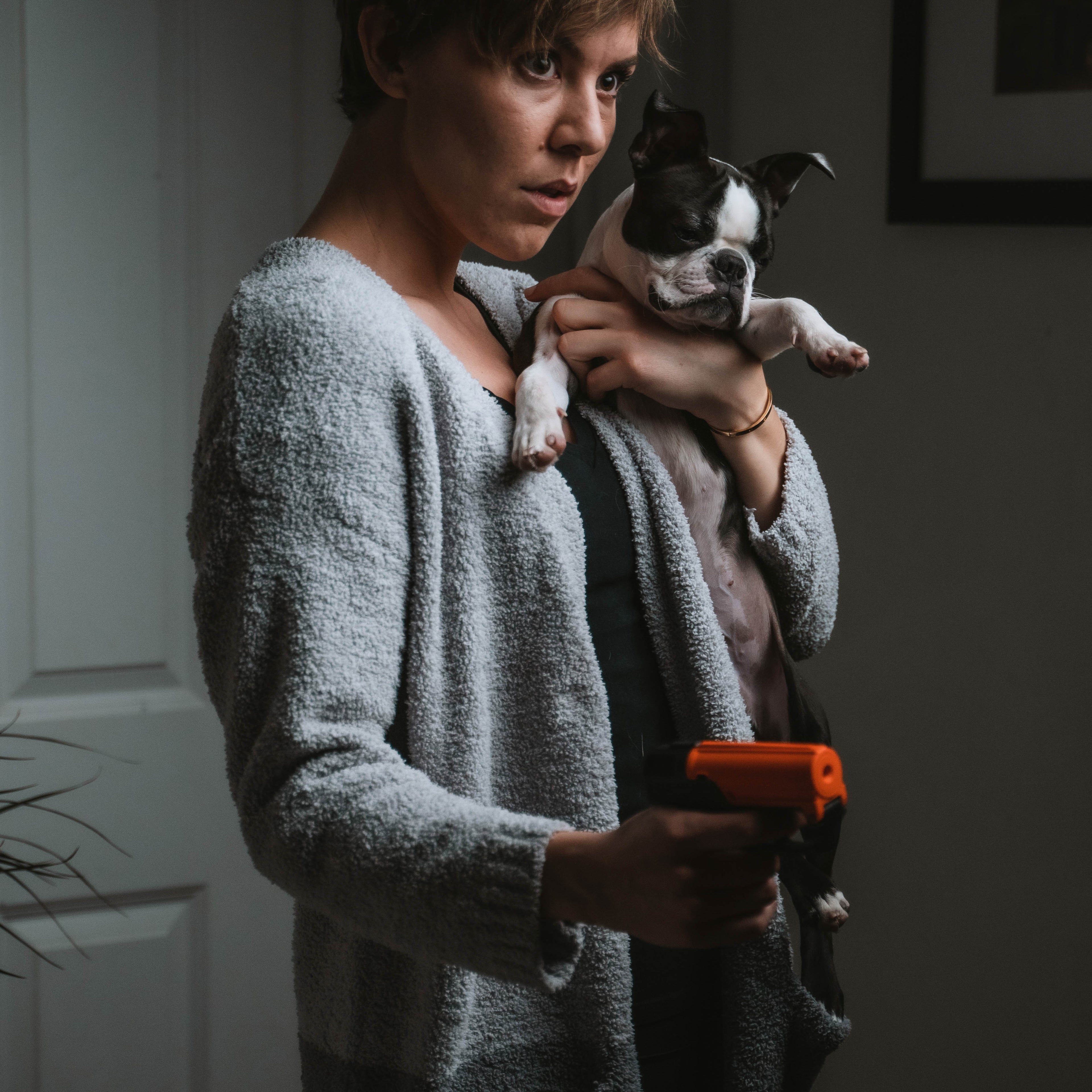 Side view of SABRE Aim & Fire Pepper Gel launcher – orange and black design with 15 ft range pepper gel deployment